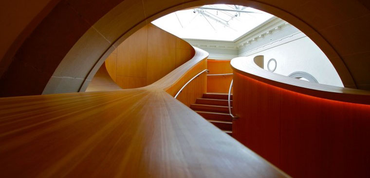 Photo from inside the Art Gallery of Ontario within the winding wooden staircase.