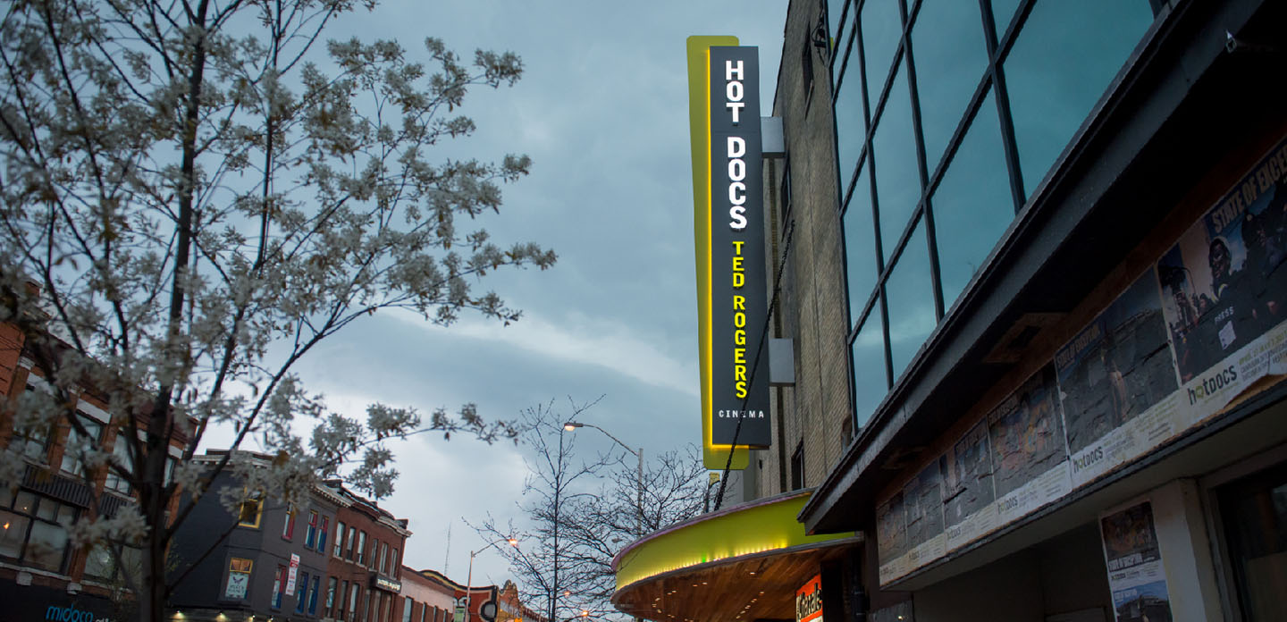 Photo from the street of Hot Docs Theatre during festival showing a crowd.