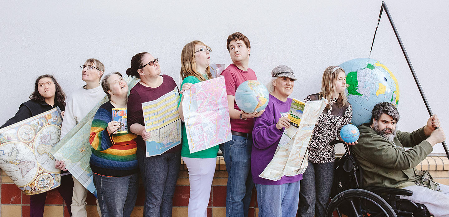 Photo of a group of people holding maps.